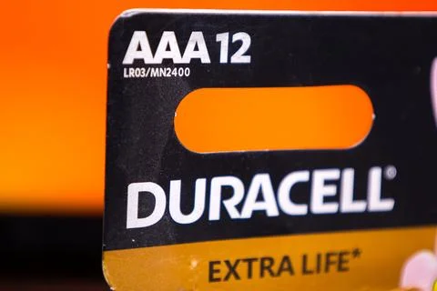 Duracell AAA 12 pack featuring trademark design with extra life label on black Stock Photos