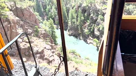 Durango to Silverton Colorado train along river and cliff Видео 211791436