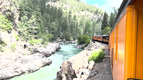 Durango to Silverton Colorado train stopped along river Видео 211791574