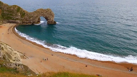 Durdle door and the big waves, filmed from above, Dorset, England Stock Footage 125712378