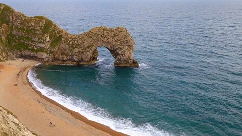 Durdle door and the big waves, filmed from above, Dorset, England Stock Footage 125777063