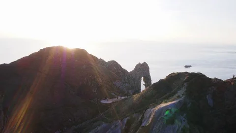 Durdle Door fly forward over and reveal with Inspire 2 drone Stock Footage 100882906