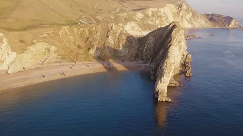 Durdle Door Orbiting Shot at Sunset with Inspire 2 Stock Footage 100882820