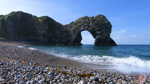 Durdle Door with pebble beach foreground Stock Footage 91414543