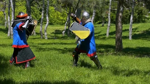 During the attack, the plate knight misses several blows with the sword over the Stock-Footage 122079659