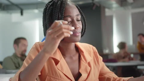 During breaking time, the teacher is watching her students and laughing at them Stock Footage 175476591