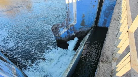 During the cold winter months, water cascades gently through the massive structu Video stock 343731059