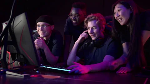 During an esports training session, a team of boys and girls sort out the latest Stock Footage 152797937