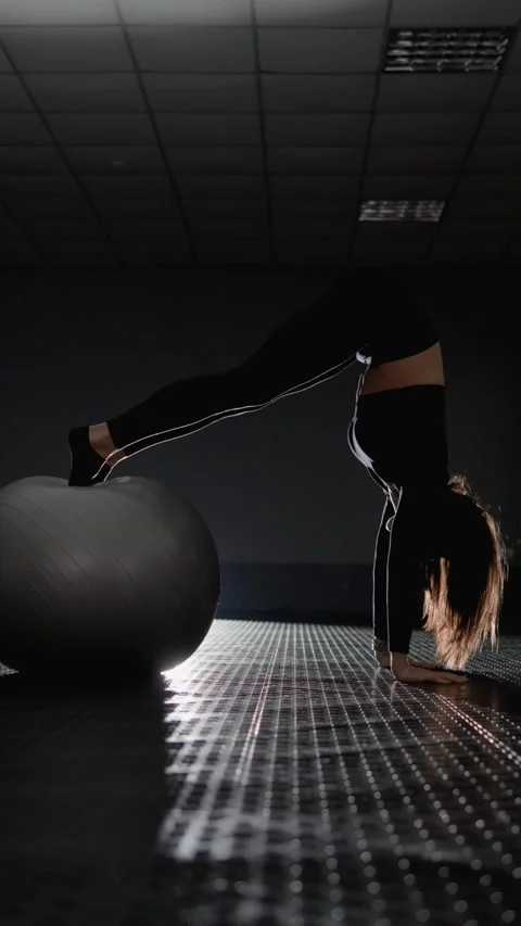 During every interaction with fitball, athletic woman demonstrates confidence Stock Footage 268254954