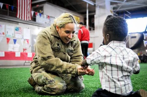 During a family activity function, friends, family and members of 1-102nd ... Stock Photos