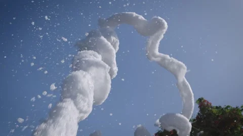 During a foam party, a column of white foam shoots upwards. A foam generator Stock-Footage 243500839