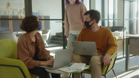 During project execution, two students meet their classmate, she asks some Stock Footage 175496549