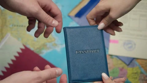 During Qatari citizenship ceremony hands transfer passport to recipient with GCC Vidéo 331261914