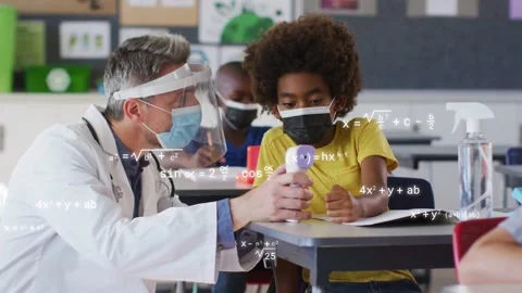 During screening school nurse leaning guiding student using temp gun, math Stock Footage 334372457