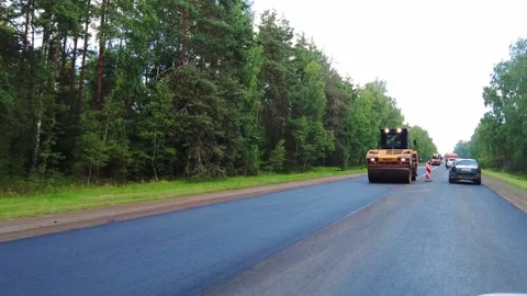 During the summer months, construction projects are underway on highways located Stock Footage 344901588