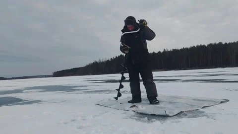 During the winter months, enthusiasts venture out onto frozen lakes, where they Stock Footage 343408036