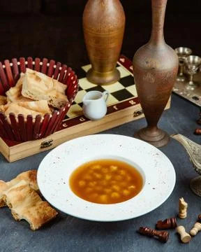 Dushbara dumpling soup plate served with vinegar and bread Stock Photos