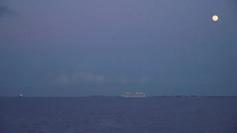 Dusk above the Perfect Day at Coco Cay island, cruise ships at sea Stock Footage 137112022