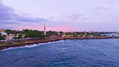 Dusk Aerial Drone View Flying Forward Over Sea Toward Amusement Park at Santo Vídeos de archivo 345044059