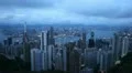 Dusk Aerial View of Hong Kong Island Skyline, Victoria Harbour, Kowloon Twilight HD Footage