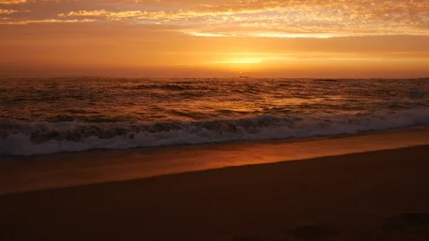 Dusk on the beach with beautiful orange sunset sky 库存影片 111166722