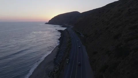 Dusk Car Tracking Winding Oceanside Pacific Coast Highway PCH Aerial Stock Footage 335424403