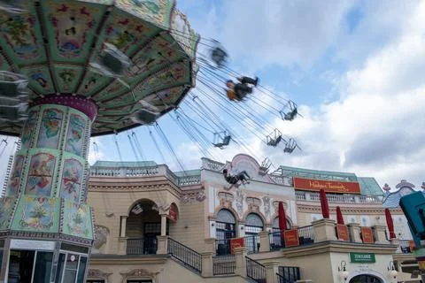 Dusk delights captivating views of a dynamic chain swing ride at prater Stock Photos