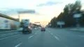 Dusk driving time lapse through city, cars with lights HD Footage