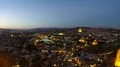 Dusk falling over large city, lights illuminating cityscape with mountains afar 4k or 4k+ Resolution