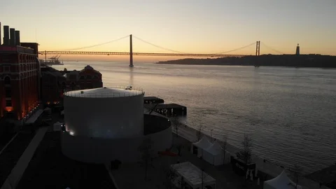 Dusk Hour over 25 de Abril Bridge in Lisbon, Portugal Stock Footage 127687720