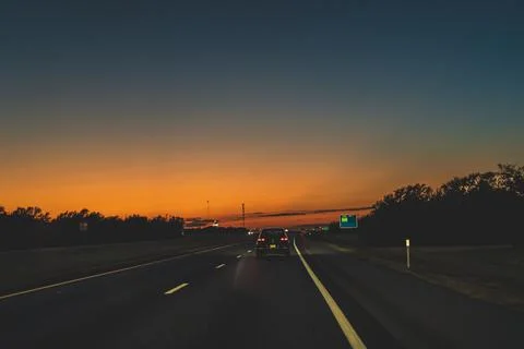 Dusk on Interstate 40 Texas U.S.A. after sunset point of view 写真素材