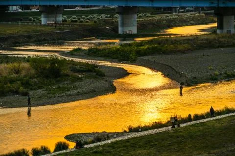Dusk of the light reflected in the Tama River Stock Photos