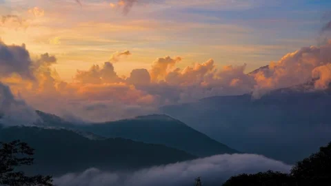 Dusk to night. In continuous mountain peaks  unprecedented,amazing cloudscape. Stock Footage 278286334