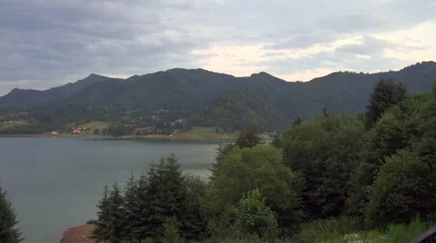 Dusk over lake surface, beautiful mountain landscape, summer evening, clouds Stock Footage 47486837