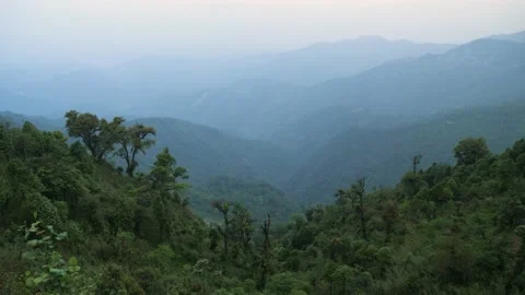 Dusk over the mountains and the forest, in Darjeeling, India Stock Footage 194460477