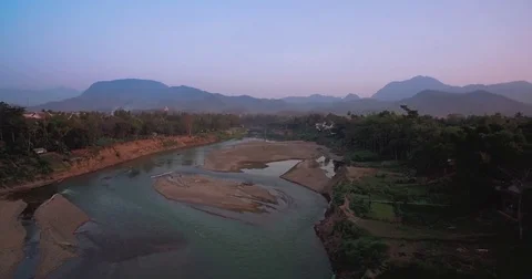 Dusk Over The Nahm Kan River, Luang Prabang, Laos, Aerial Drone Shot Video stock 74487684