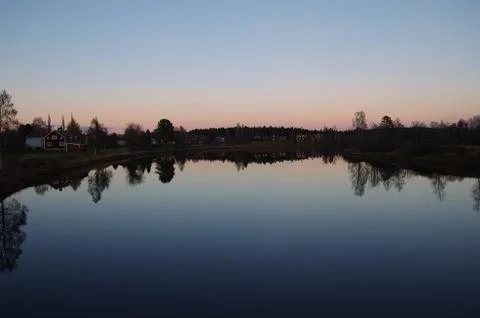 Dusk over a river Stock Photos