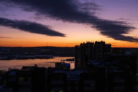 Dusk paints the sky with deep purples and fiery reds Stock Photos