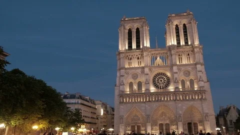 Dusk Pan Right Reveal Centered Facade Notre Dame Cathedral Night Lights Paris Stock Footage 93407028