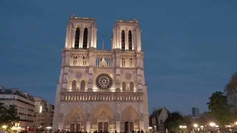 Dusk Panoramic Pan Right Lighted Centered Facade Notre Dame Cathedral Paris Stock Footage 93406924