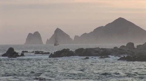 Dusk Pirate Ship Sails In Front of Drinking Dragon Stock-Footage 1013394