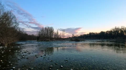 Dusk by the river in the park Video stock 267623546