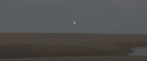 Dusk Shot of Suffolk Shingle Beach Zooming In to Rising Moon Stock-Footage 320114729