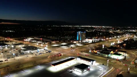 Dusk shot in time lapse showing business district, intersection and cars Stock Footage 221509301