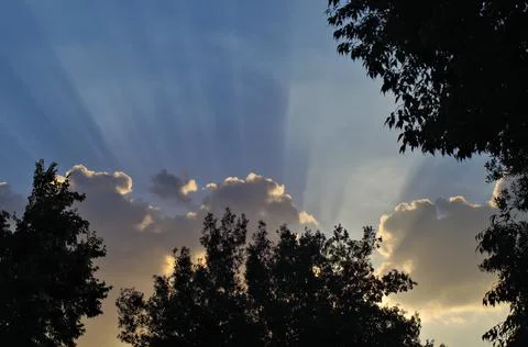 Dusk sky with clouds and rays Stock Photos