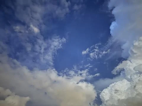 A dusk sky completely filled with rain clouds. Stock Photos