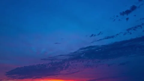 Dusk Sky timelapse. Moving clouds and sunset. Clouds float through the evening Stock Footage 295823331