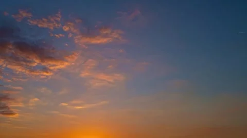 Dusk Sky timelapse. Moving clouds and sunset. Clouds float through the evening Stock Footage 295870554
