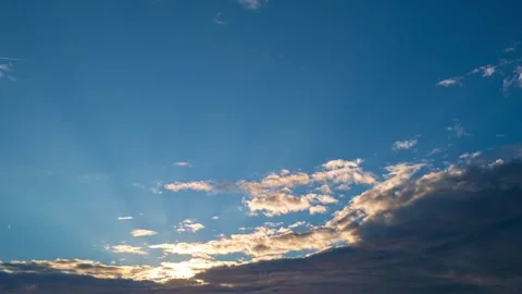 Dusk Sky timelapse. Moving clouds and sunset. Clouds float through the evening Video stock 317360627