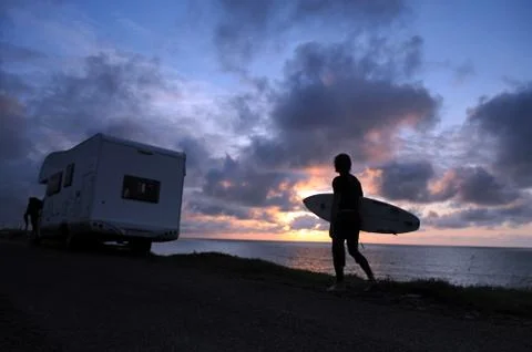 Dusk with surfer Stock Photos